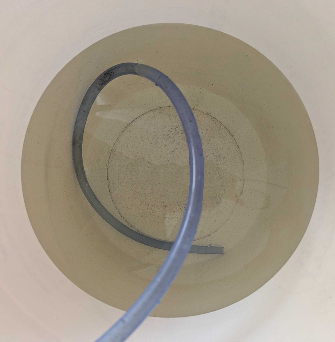Yellow_water_in_bucket_copy_Vertical